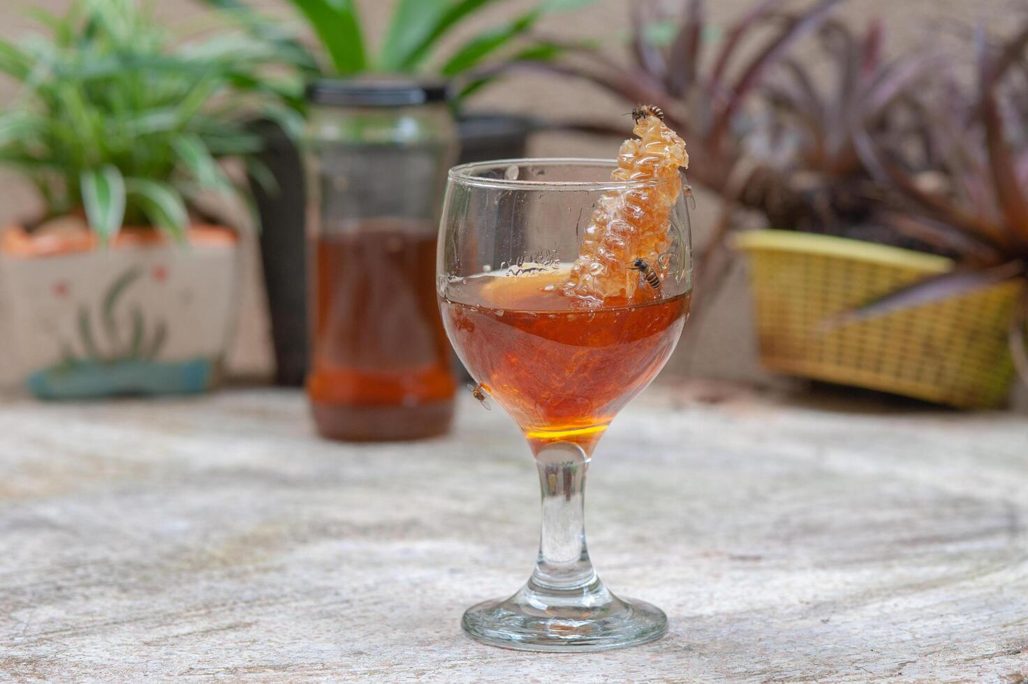 Wild honey, natural organic food, in a glass bottle photo
