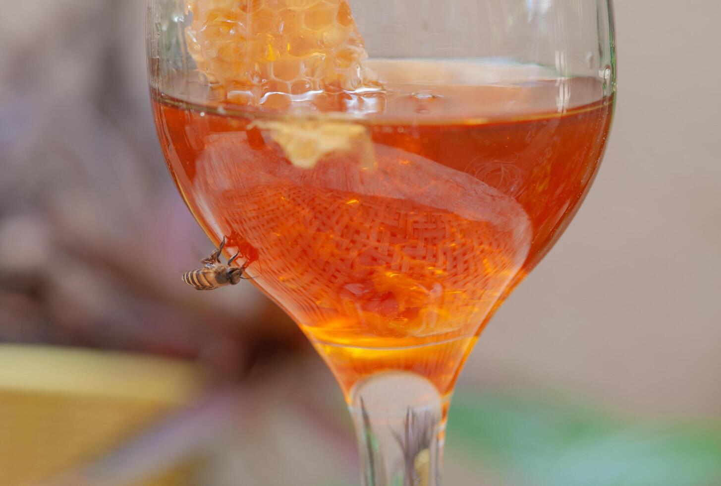 Wild honey, natural organic food, in a glass bottle photo