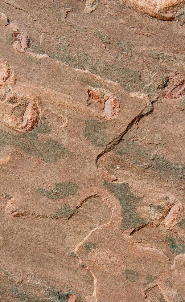 Red stone surface with pattern photo