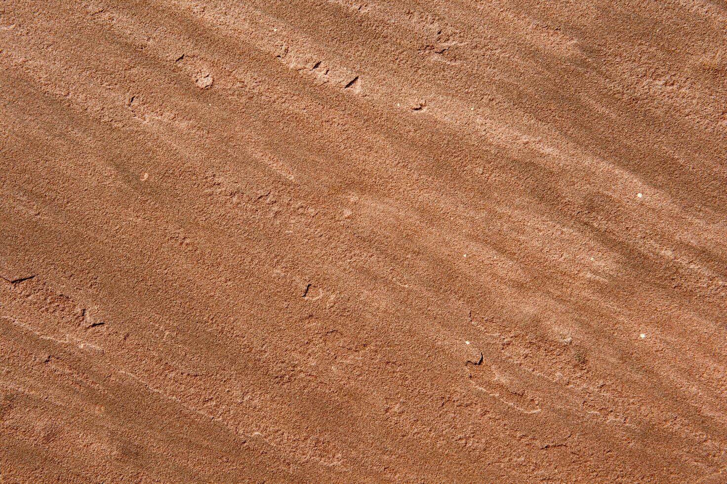 Red stone surface with pattern photo