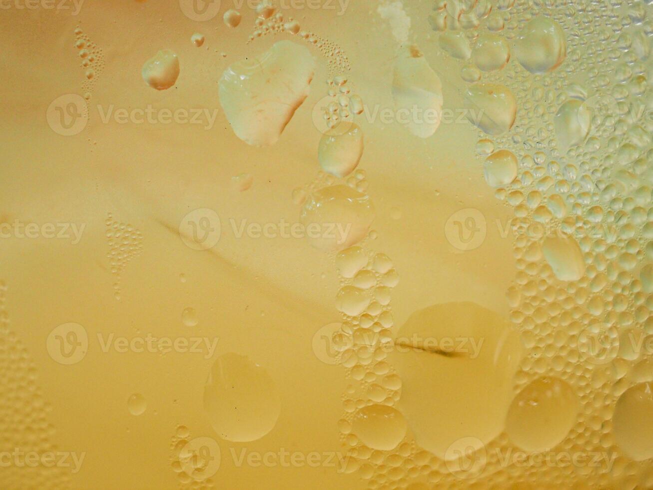 Drops of ice on an iced coffee glass photo