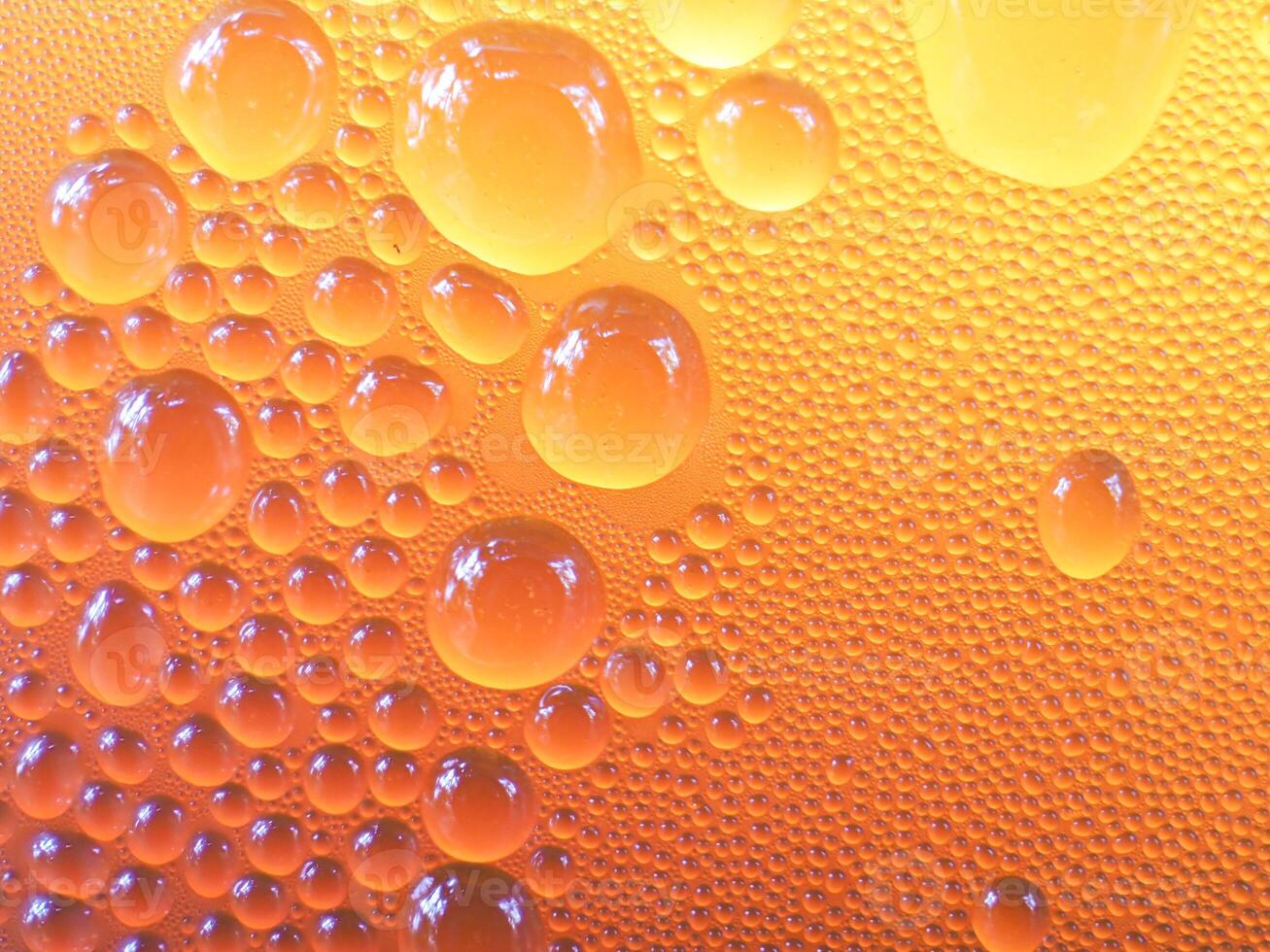 Drops of ice on an iced coffee glass photo