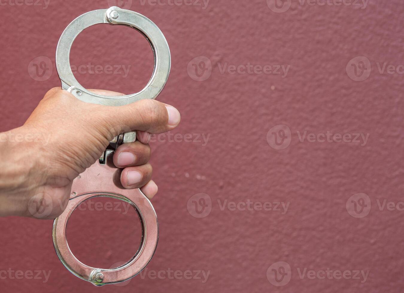 Police demonstrate the use of handcuffs photo