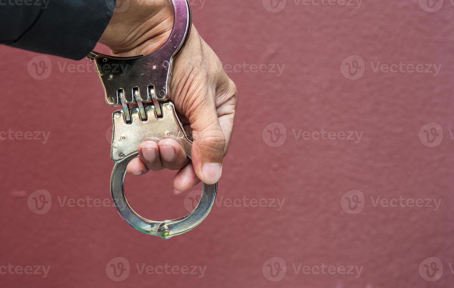 Police demonstrate the use of handcuffs photo