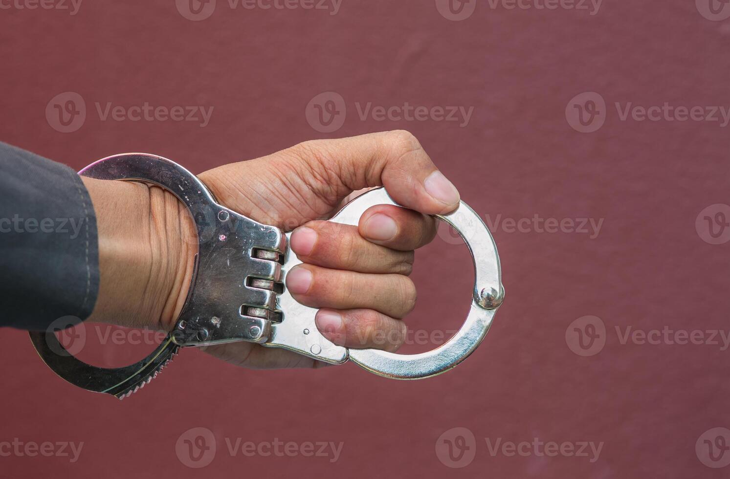 Police demonstrate the use of handcuffs photo