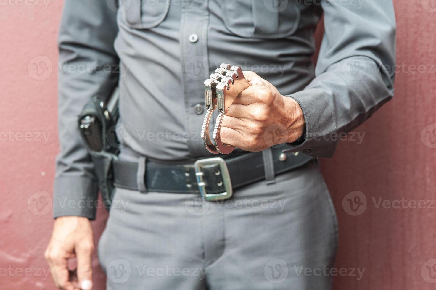 Police demonstrate the use of handcuffs photo