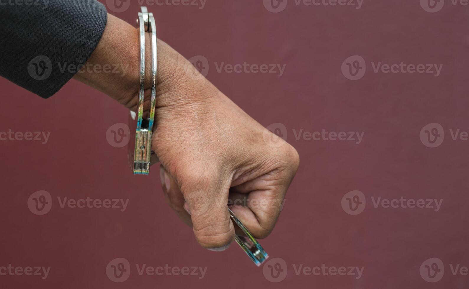 Police demonstrate the use of handcuffs photo