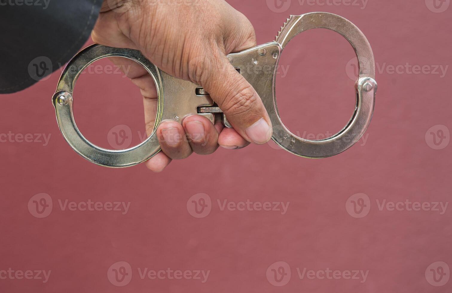 Police demonstrate the use of handcuffs photo