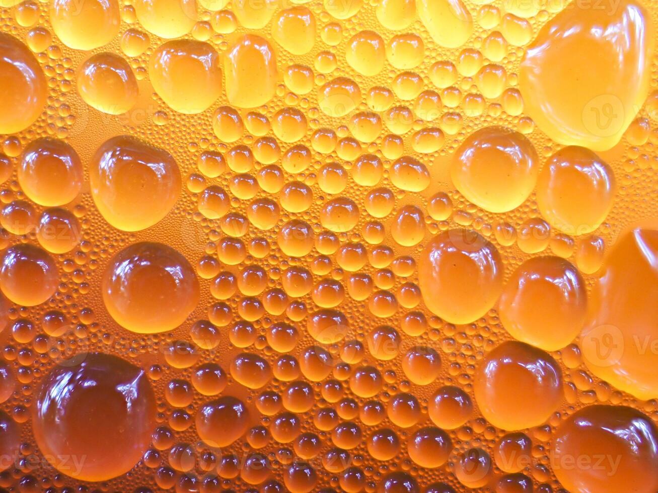 Drops of ice on an iced coffee glass photo