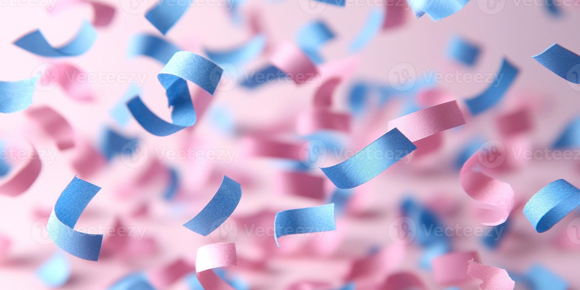 Confetti in pink and blue swirls down in a delightful display during a festive occasion photo