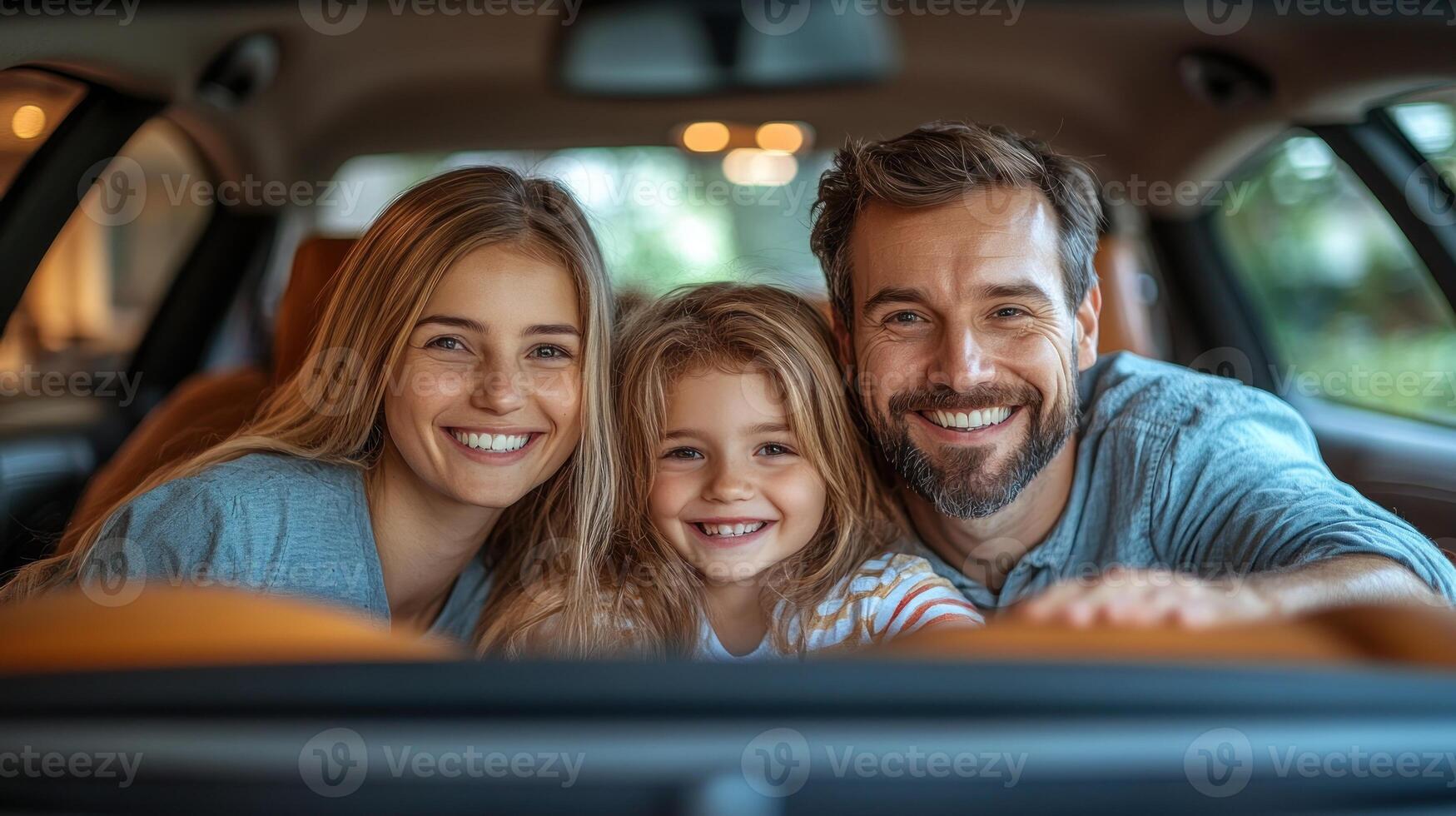 A joyful family enjoys time together inside their vehicle with bright smiles photo
