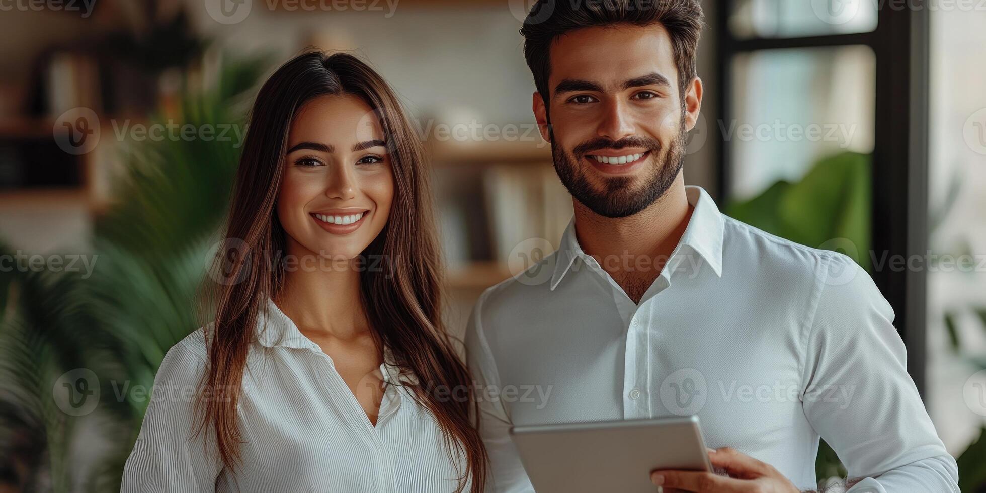 Two professionals pose happily together, showing their confidence and teamwork in a well-lit space photo
