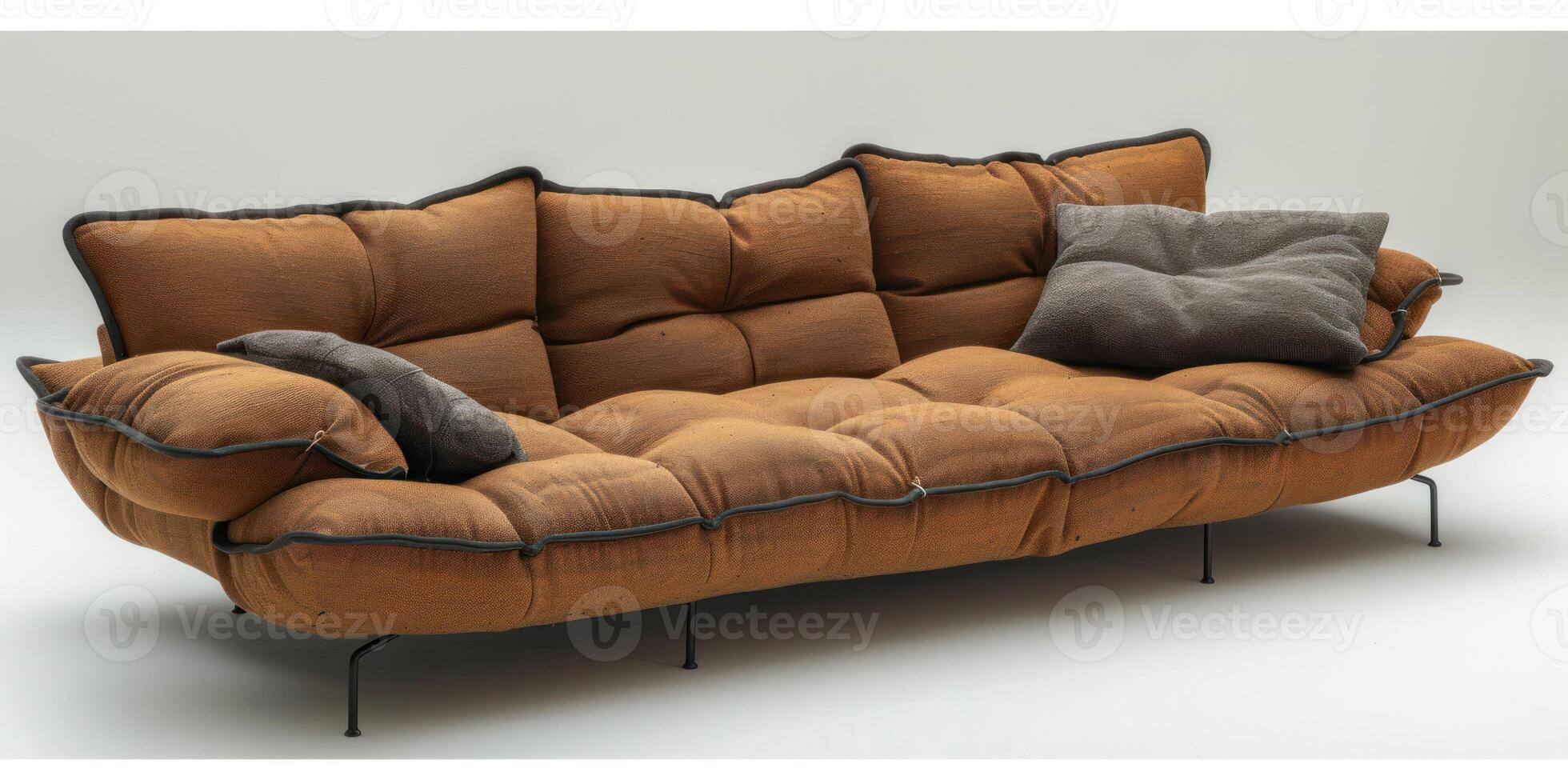A stylish brown sofa with cushions is showcased in a contemporary studio environment photo