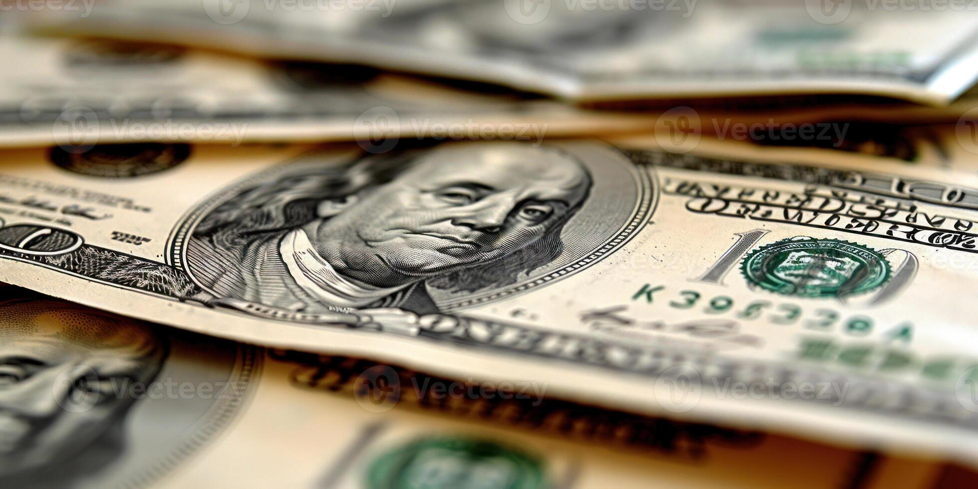 A close-up view of a US one hundred dollar bill, with Benjamin Franklin's portrait in focus photo