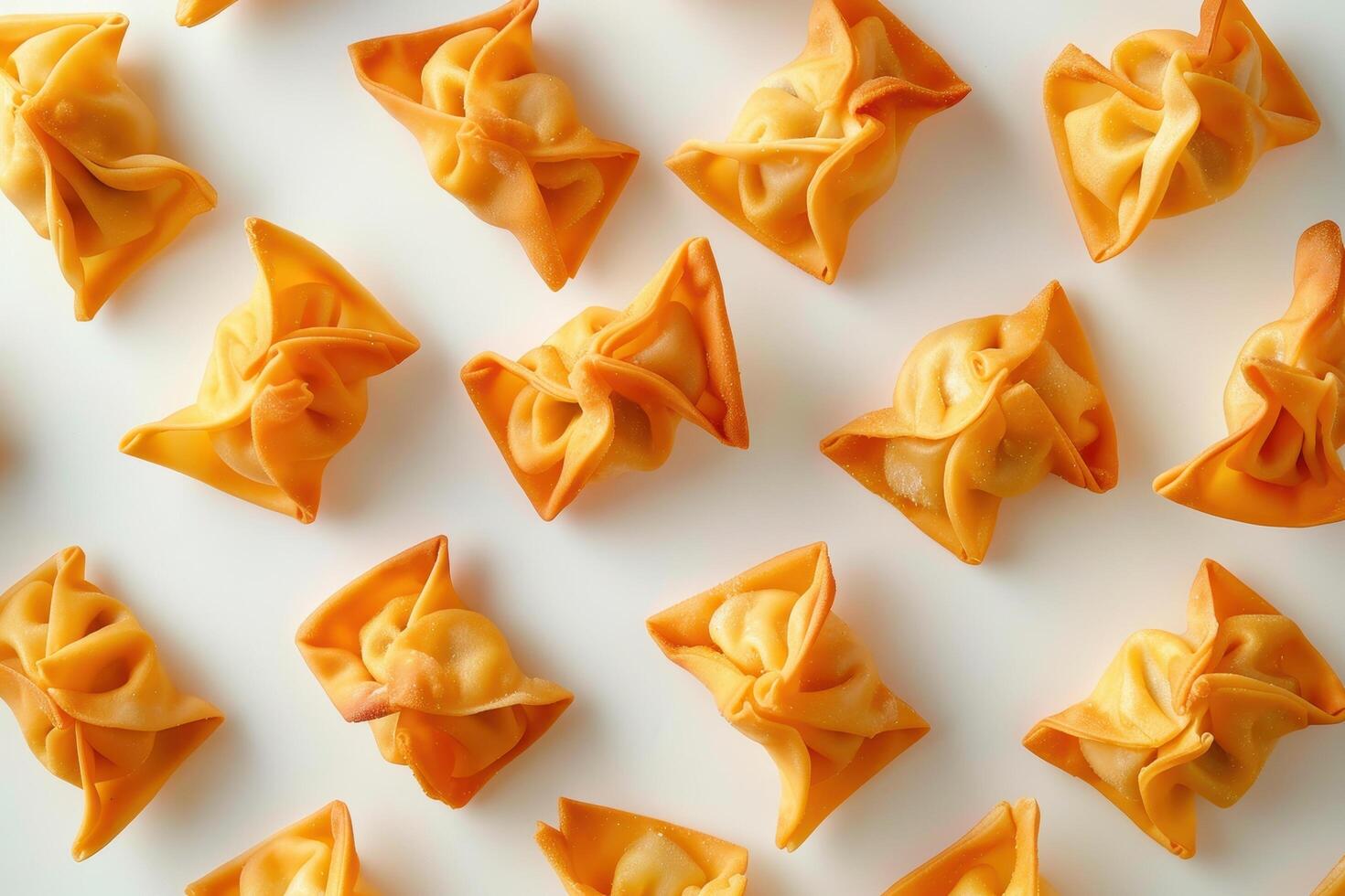 Close-up of Golden Fried Wonton Dumplings on White Background photo