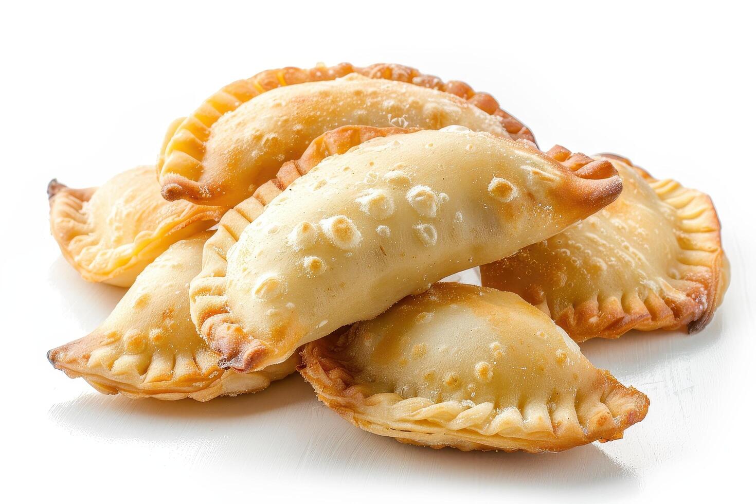 A Pile of Golden Brown Empanadas with Flaky Crust photo