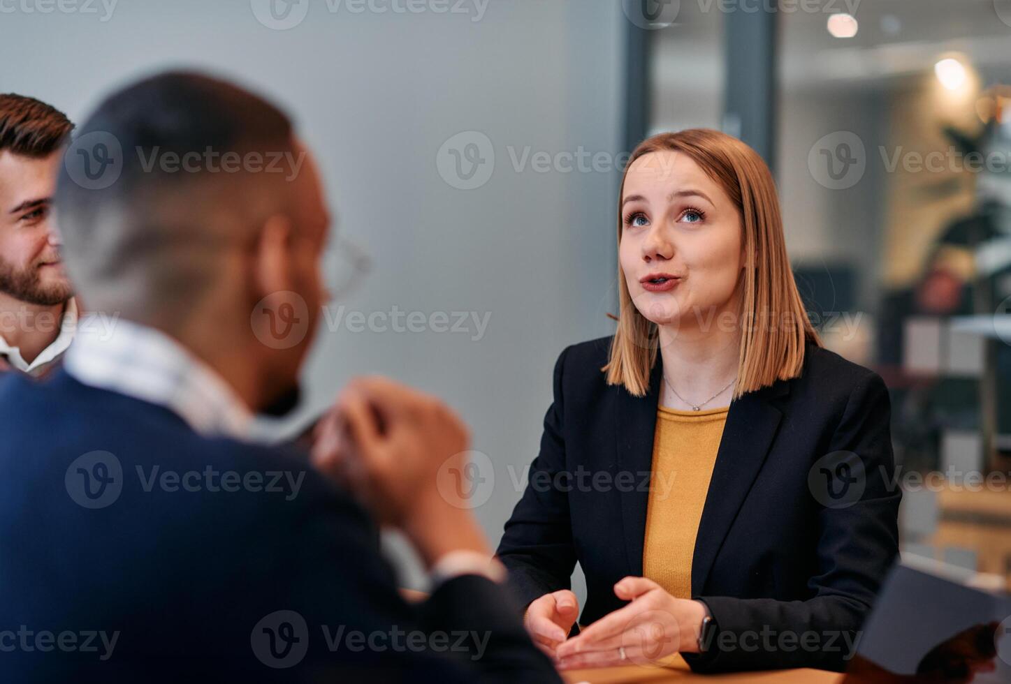 Businesswoman Leading Discussion in Modern Office Setting photo