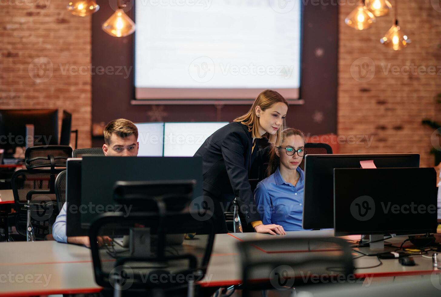 Strategic Business Meeting. Group of Professionals Collaborating in Office Using Computers photo
