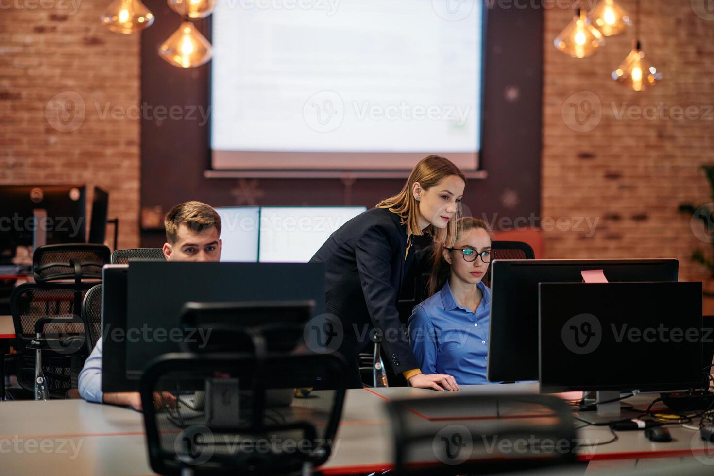 Strategic Business Meeting. Group of Professionals Collaborating in Office Using Computers photo