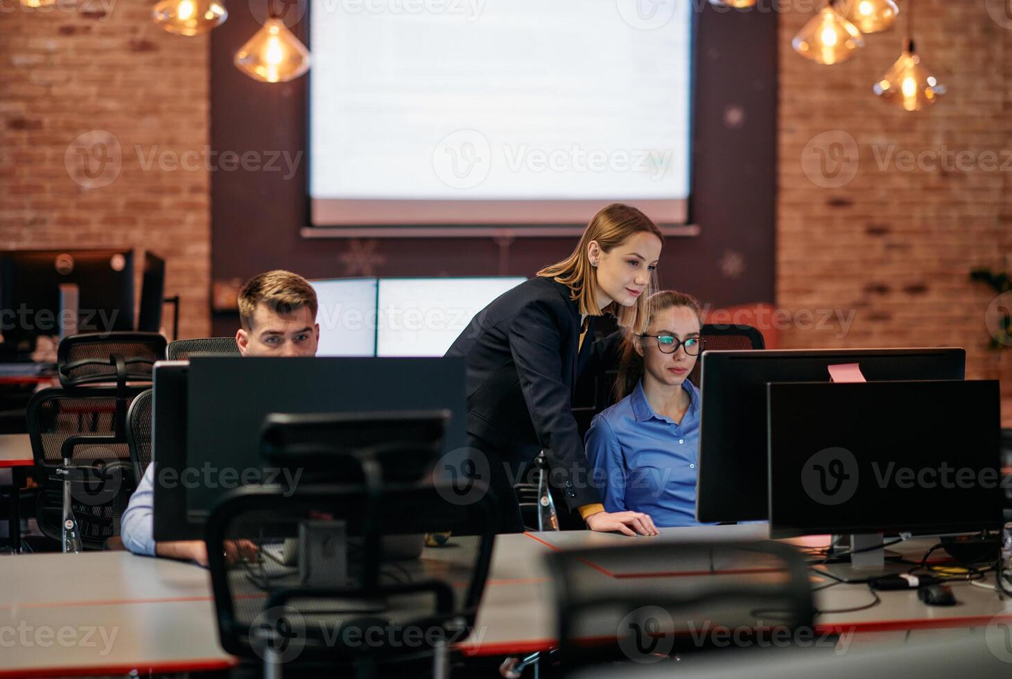Strategic Business Meeting. Group of Professionals Collaborating in Office Using Computers photo