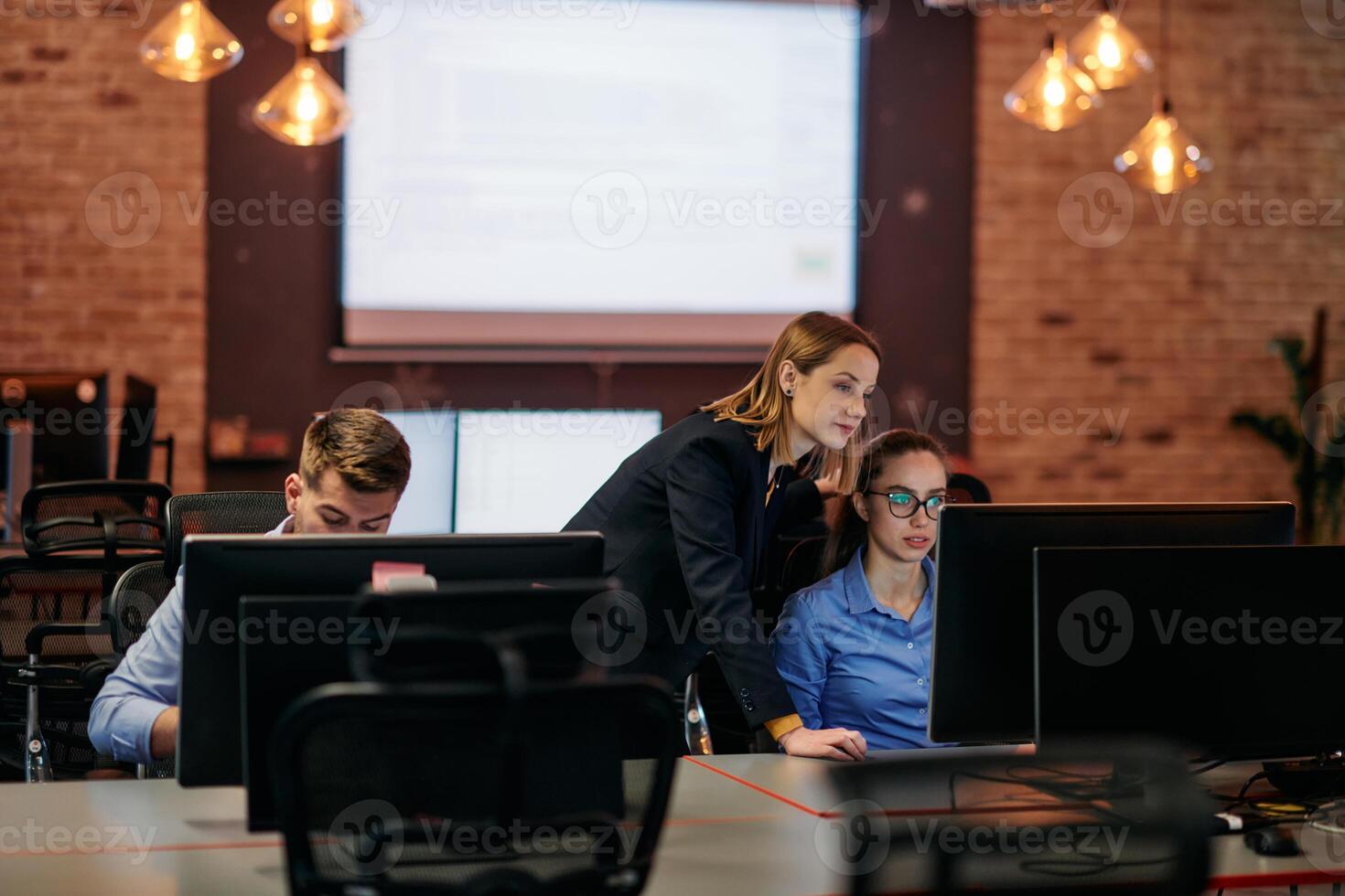 Strategic Business Meeting. Group of Professionals Collaborating in Office Using Computers photo