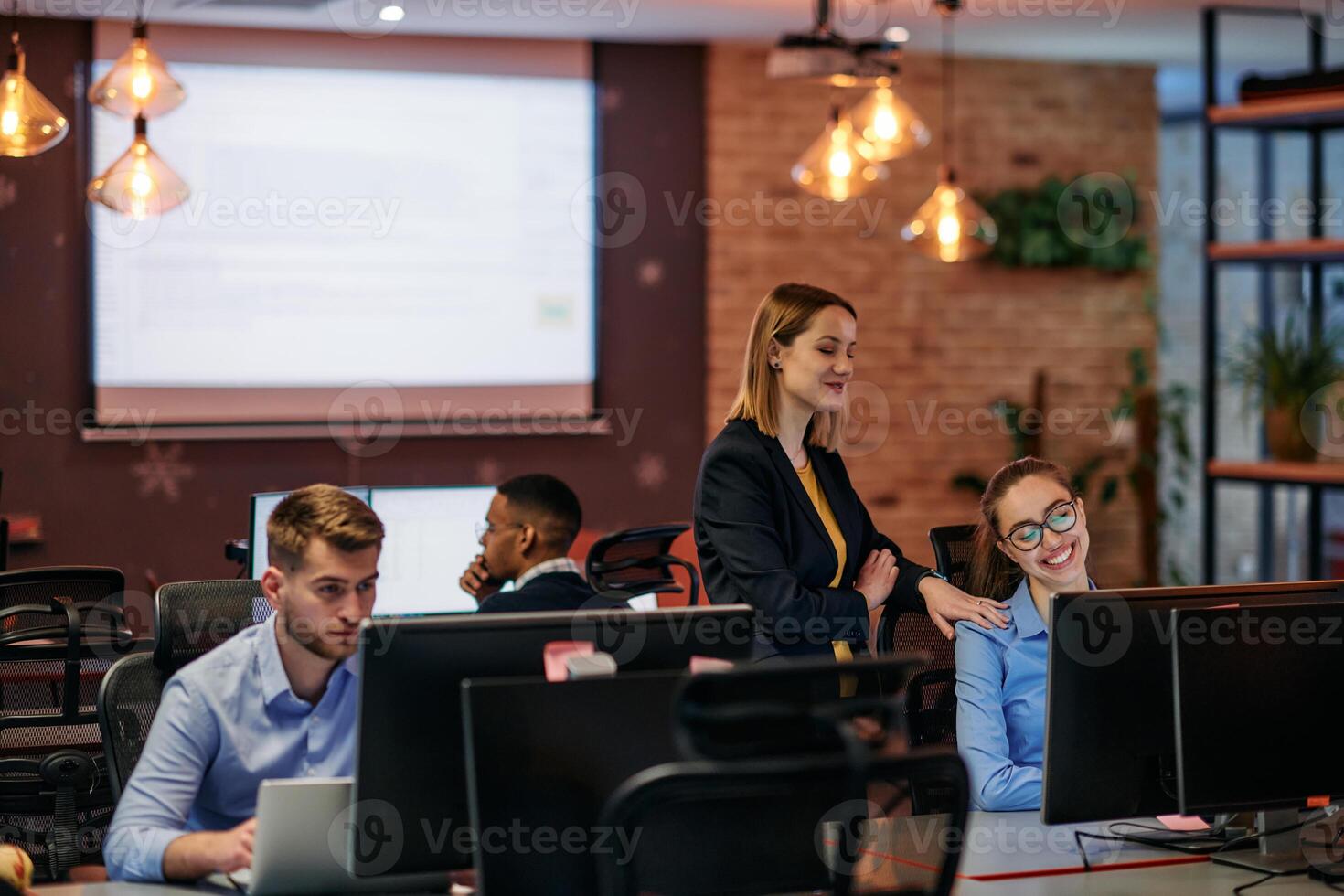 Strategic Business Meeting. Group of Professionals Collaborating in Office Using Computers photo