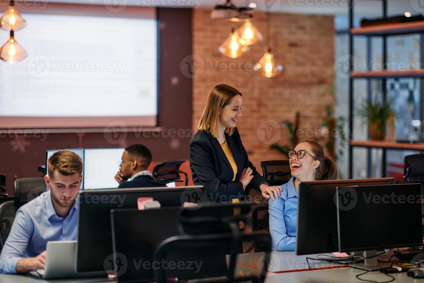 Strategic Business Meeting. Group of Professionals Collaborating in Office Using Computers photo