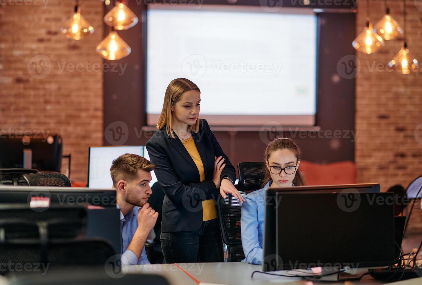 Strategic Business Meeting. Group of Professionals Collaborating in Office Using Computers photo
