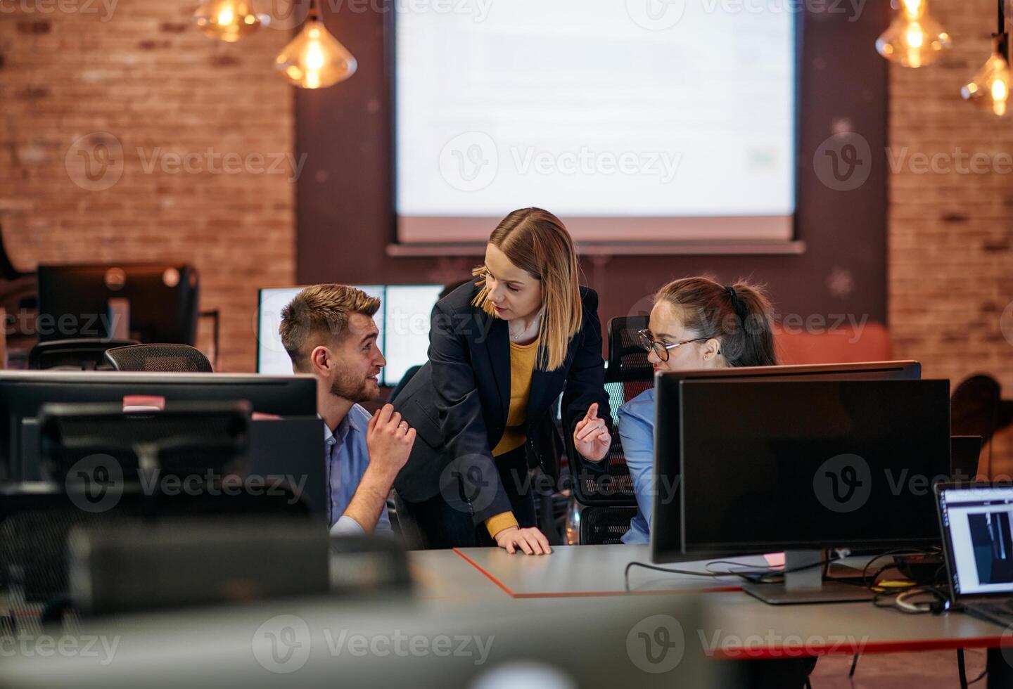 Strategic Business Meeting. Group of Professionals Collaborating in Office Using Computers photo