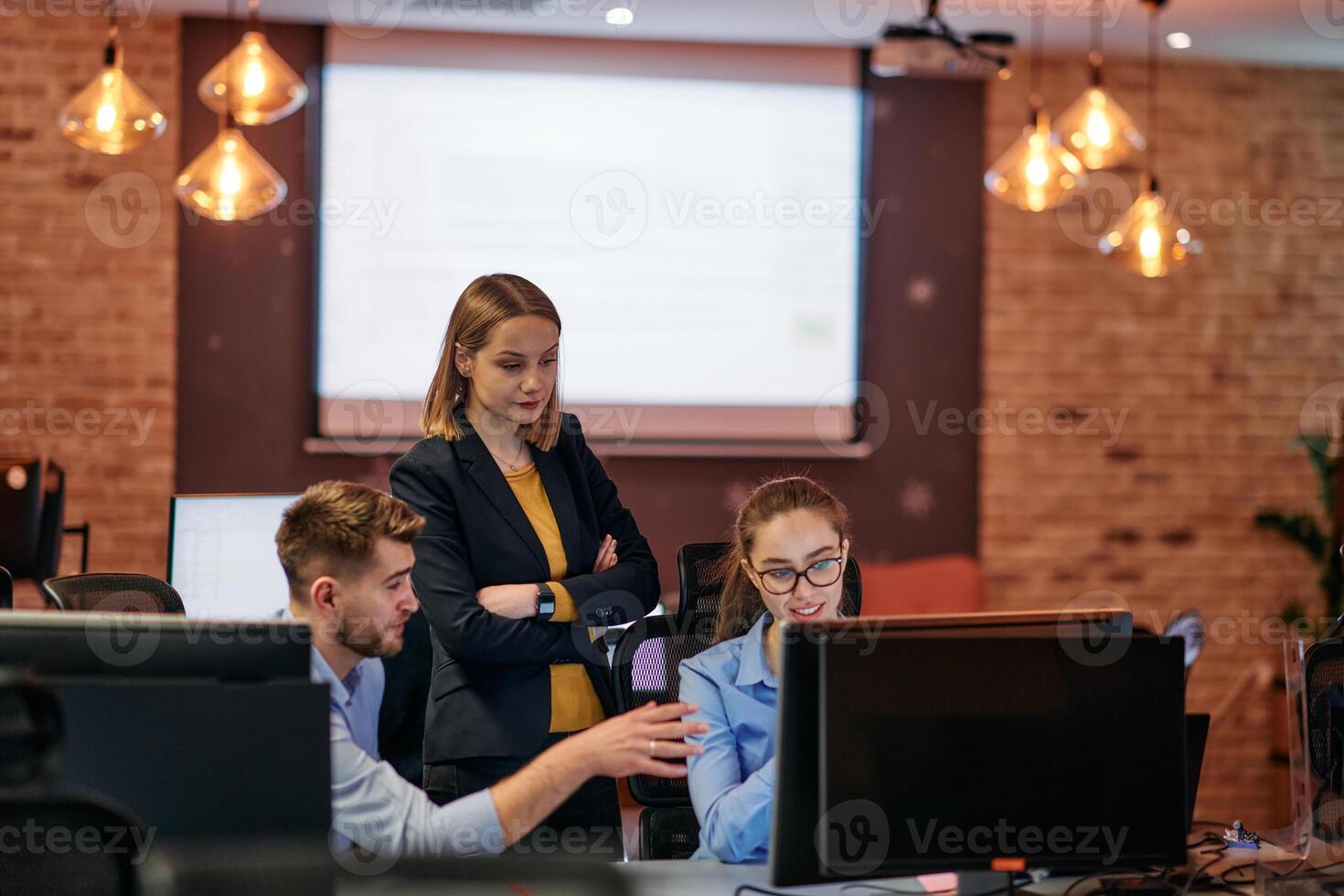 Strategic Business Meeting. Group of Professionals Collaborating in Office Using Computers photo