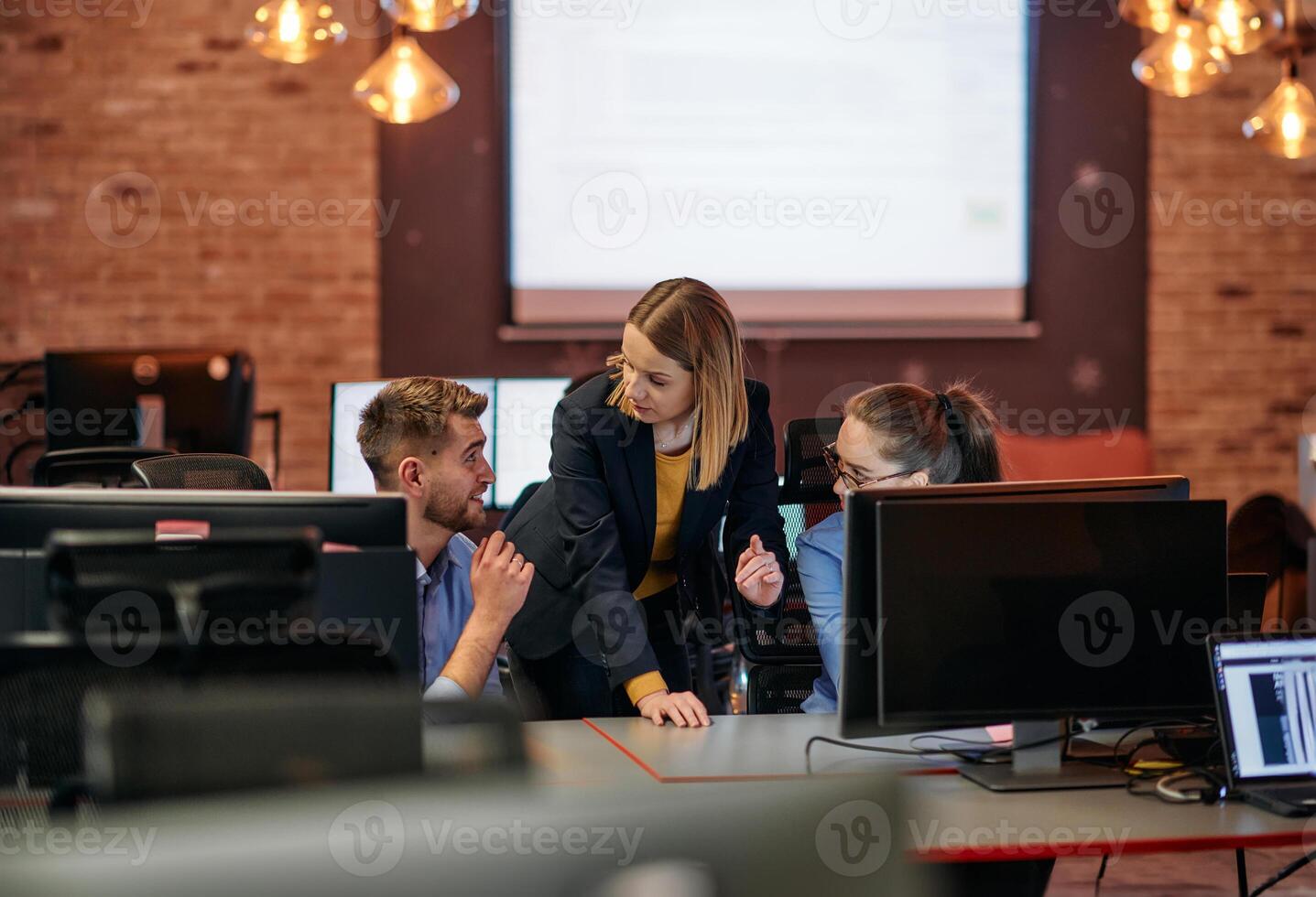 Strategic Business Meeting. Group of Professionals Collaborating in Office Using Computers photo