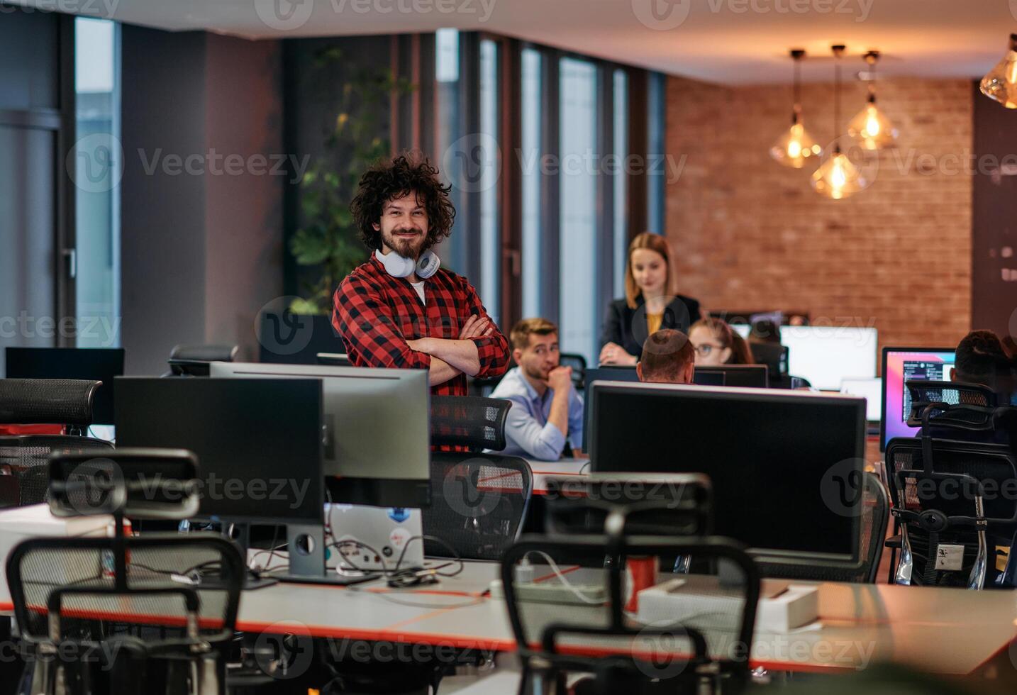 Strategic Business Meeting. Group of Professionals Collaborating in Office Using Computers photo