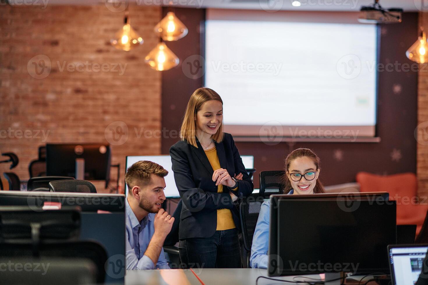 Strategic Business Meeting. Group of Professionals Collaborating in Office Using Computers photo