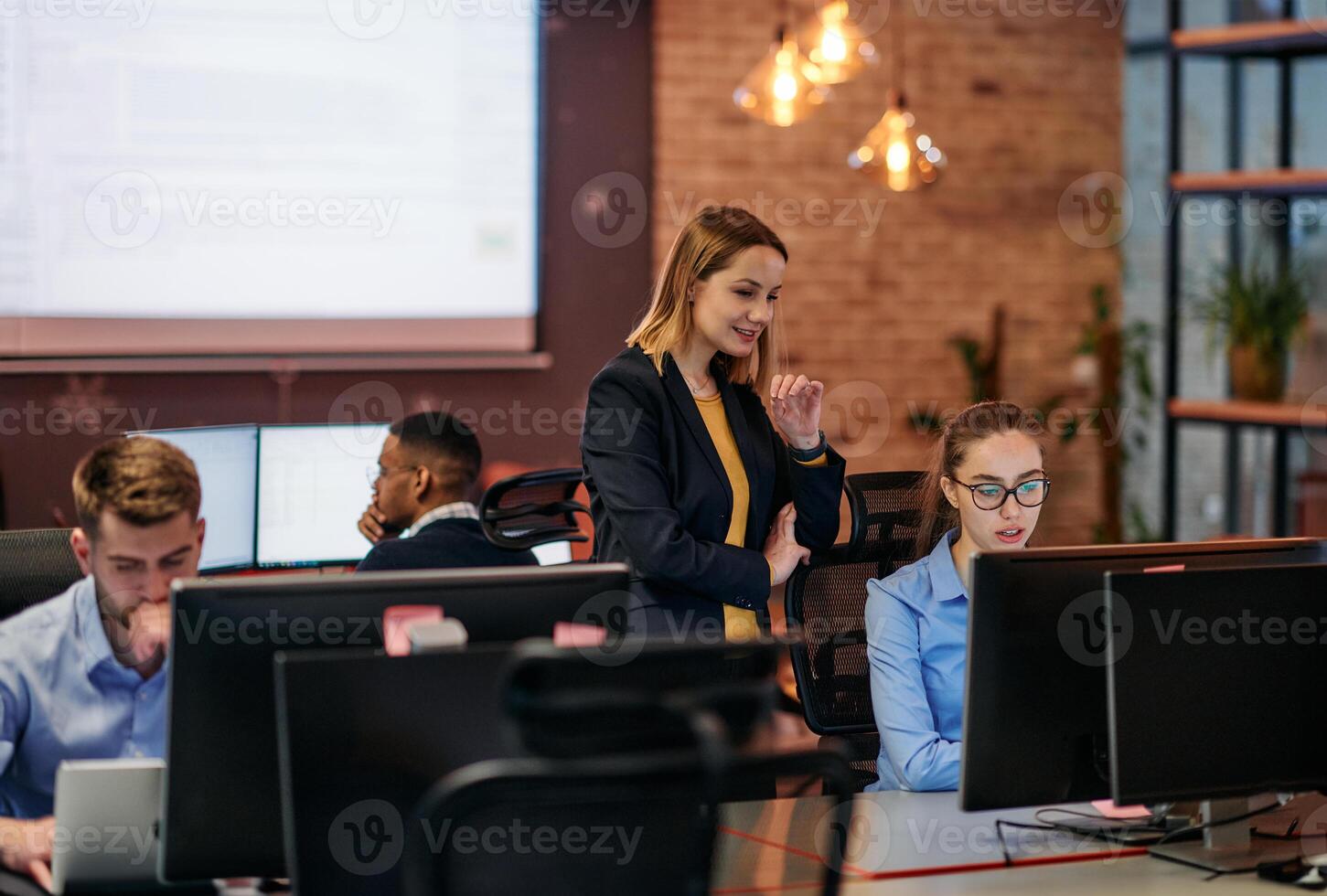Strategic Business Meeting. Group of Professionals Collaborating in Office Using Computers photo