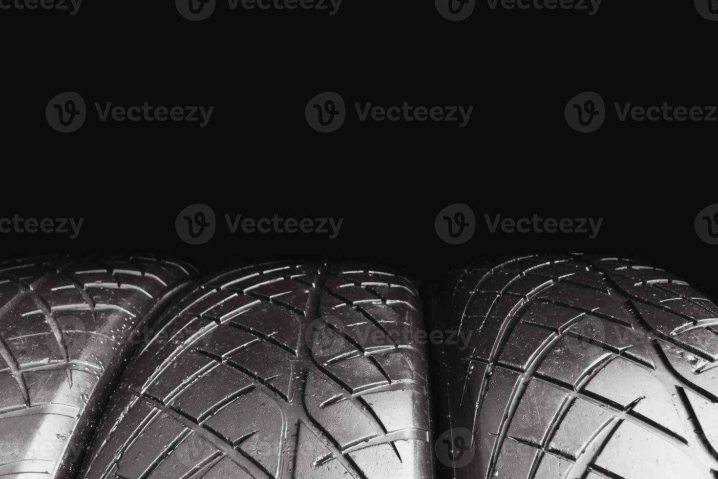 Car tire row isolated on black background with copy space for text , Old car tire with scratch , Car tire concept photo