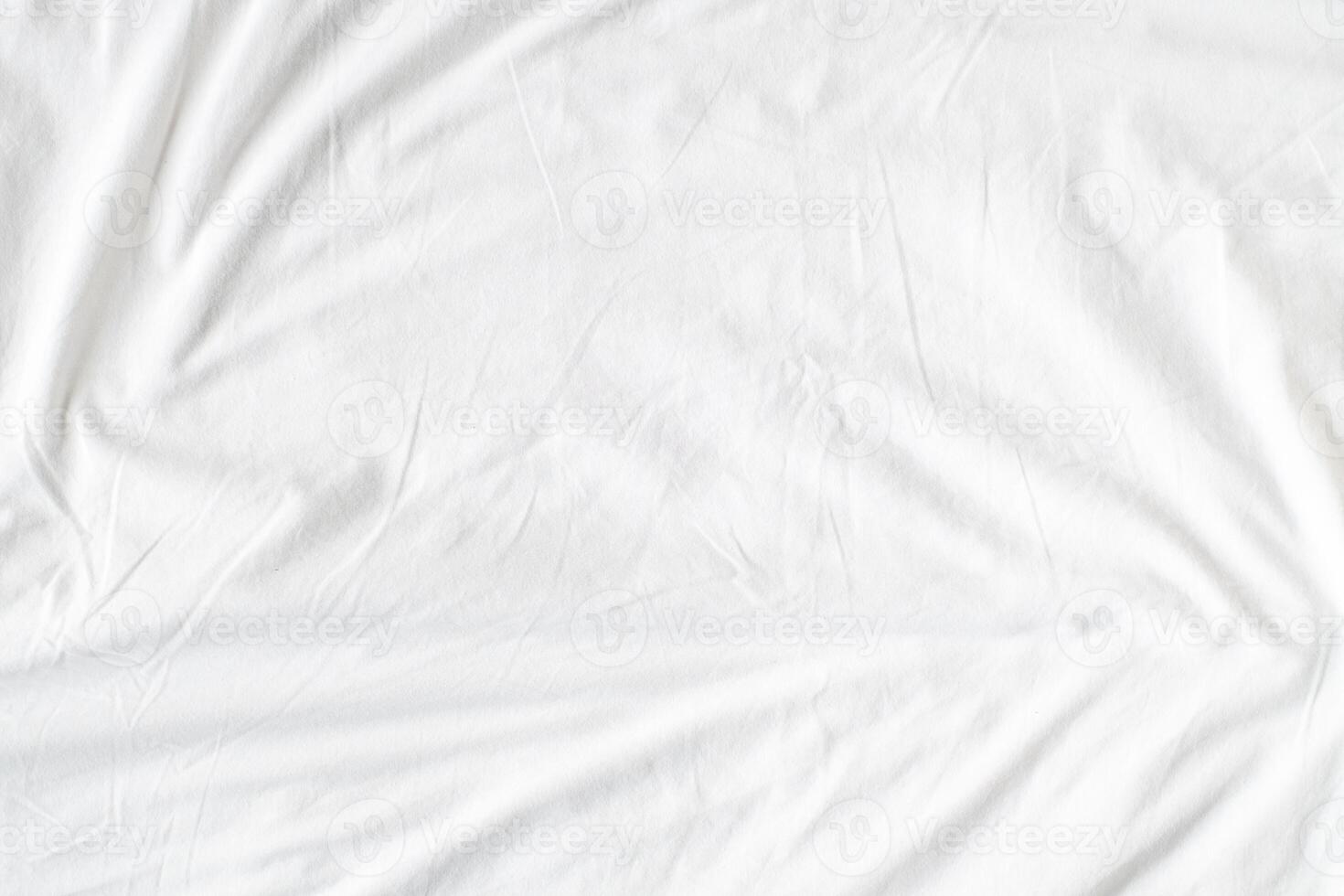 Abstract White Bedding Sheets or White wrinkled fabric background texture and Texture with copy-space Creased or wrinkled white fabric,Soft focus photo