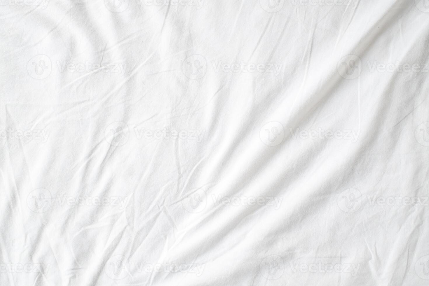 Abstract White Bedding Sheets or White wrinkled fabric background texture and Texture with copy-space Creased or wrinkled white fabric,Soft focus photo