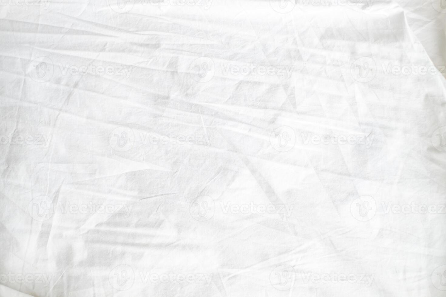 Abstract White Bedding Sheets or White wrinkled fabric background texture and Texture with copy-space Creased or wrinkled white fabric,Soft focus photo