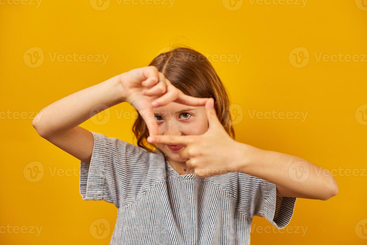 Girl Creating Frame With Hands photo