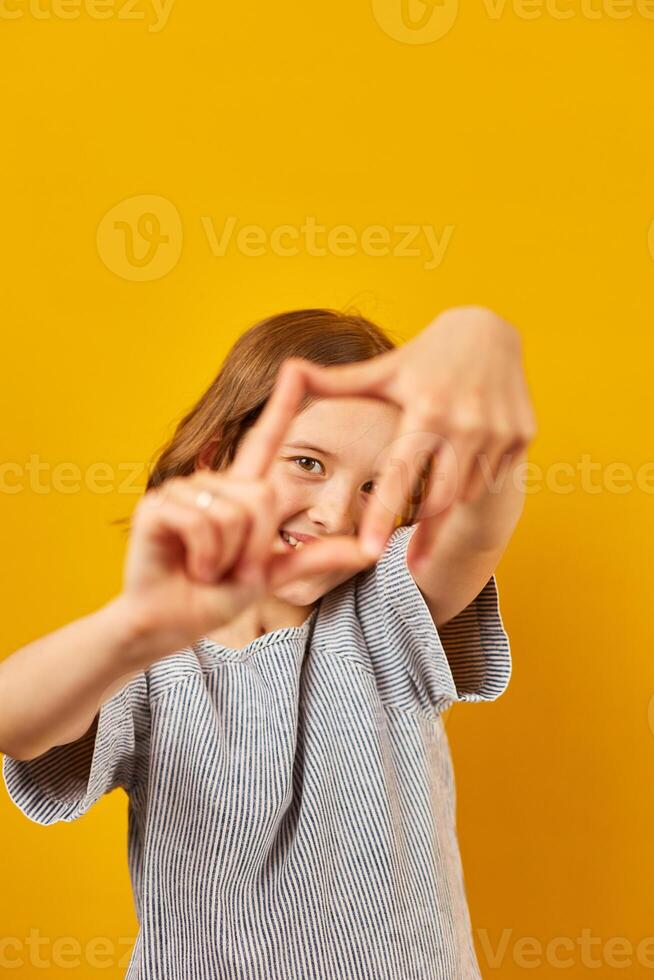 Girl Creating Frame With Hands photo