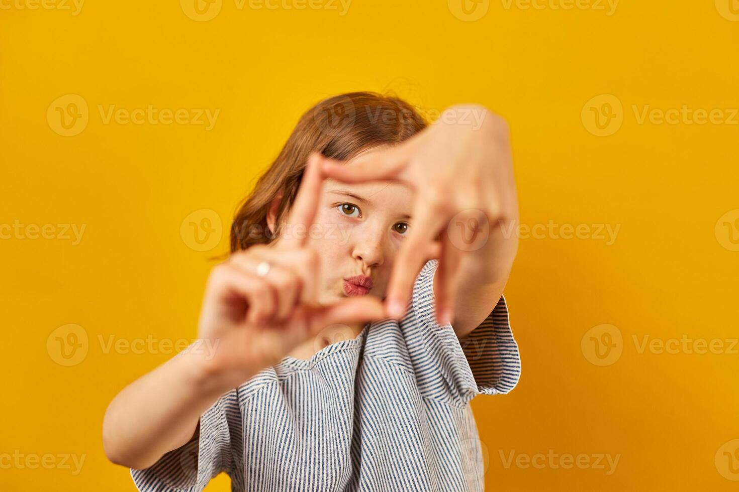 Girl Creating Frame With Hands photo