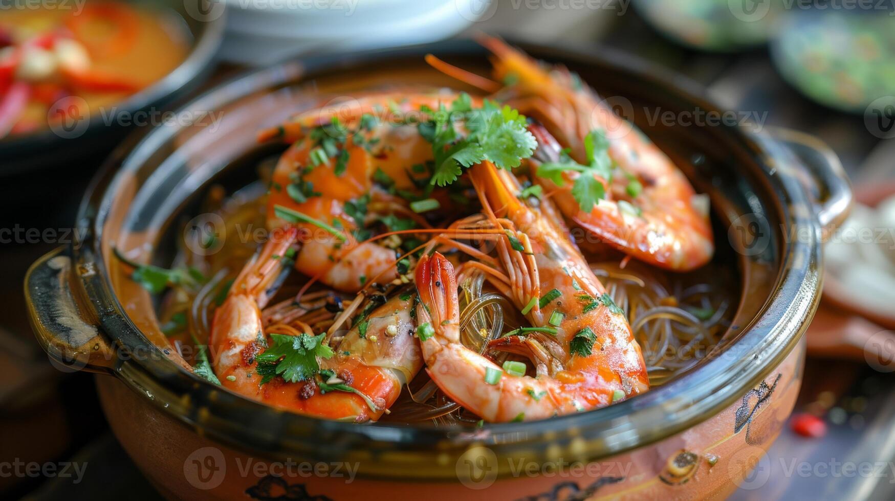 Savory prawns served in a clay pot with glass noodles, garnished with fresh herbs, creating a flavorful and aromatic dish, Thai food. photo