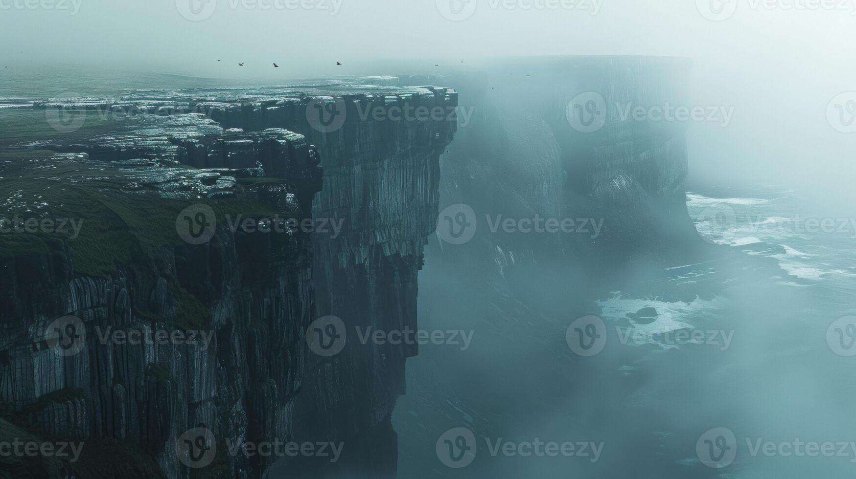 Dramatic mist-covered cliffs rise above stormy ocean waves, creating a mysterious and atmospheric seascape. photo