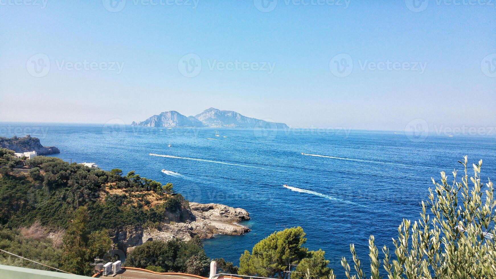 Italian Coastal View with Distant Island photo