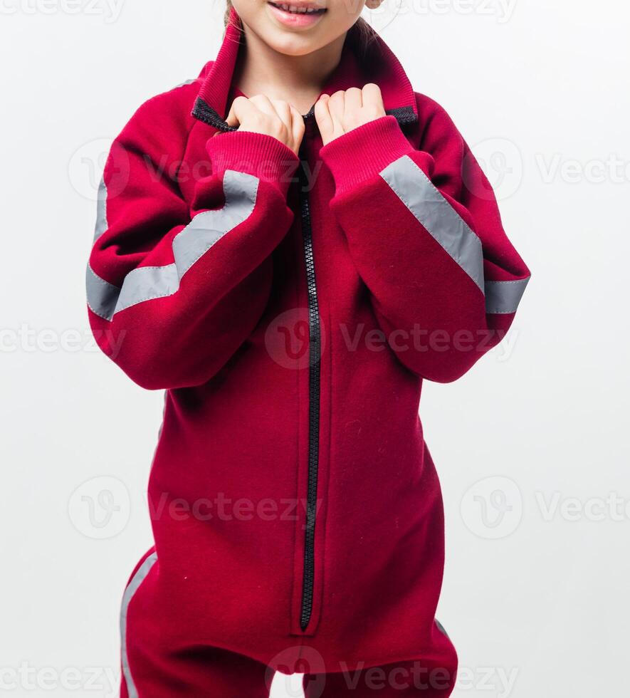 Child in red jumpsuit with grey stripes photo