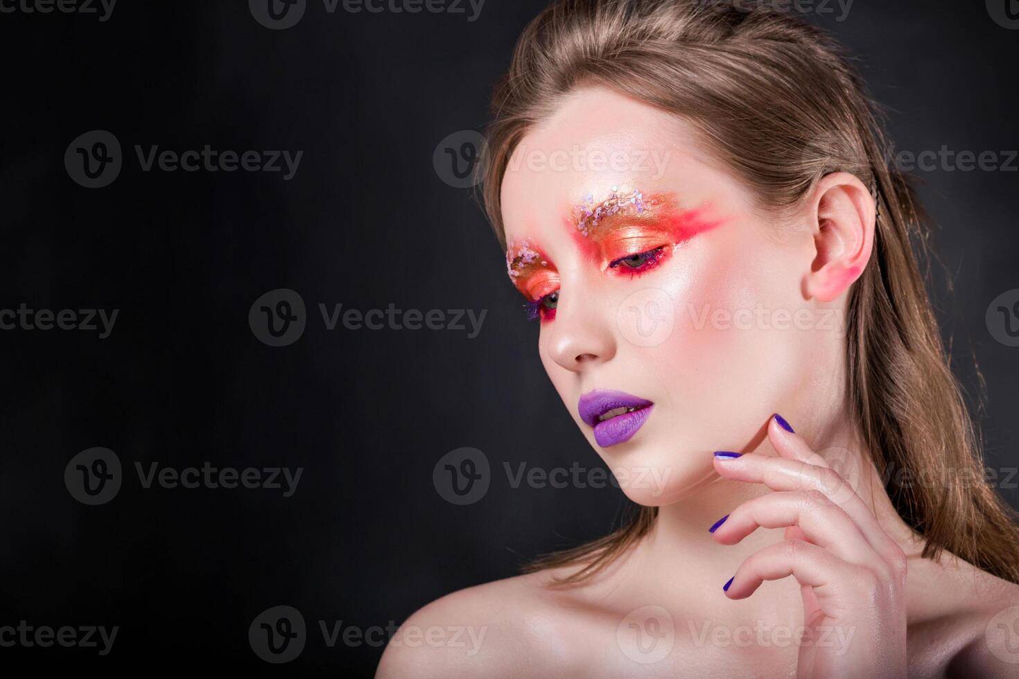 Sensitive Woman with Artistic Makeup photo