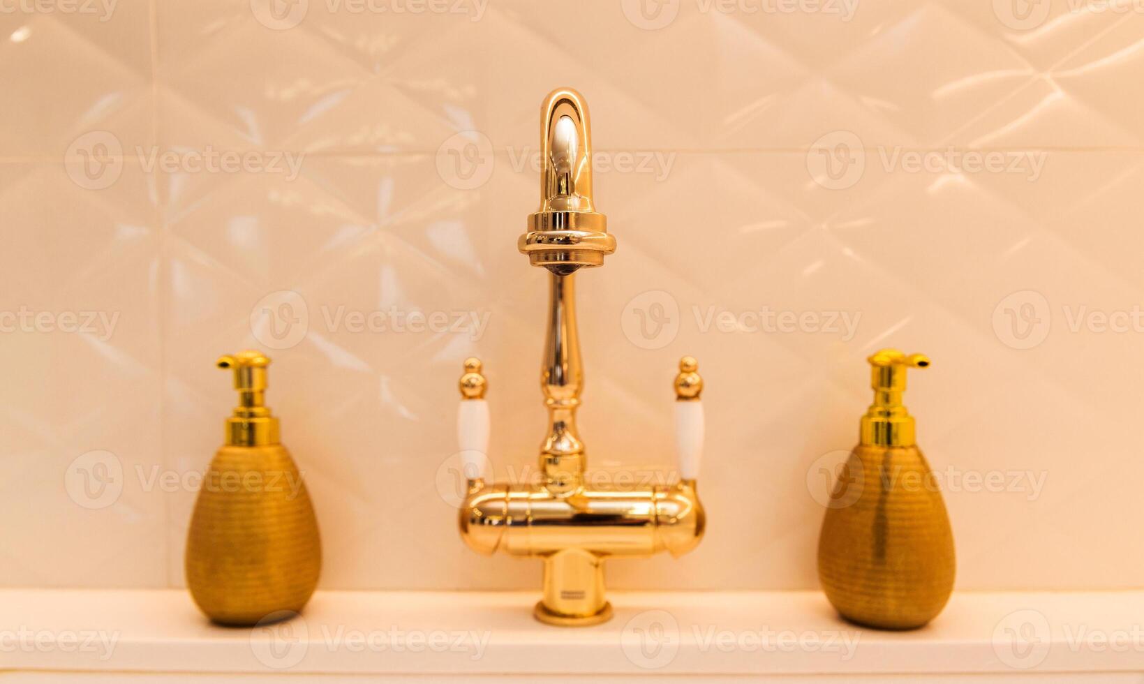Gold Faucet with Soap Dispensers in Kitchen photo