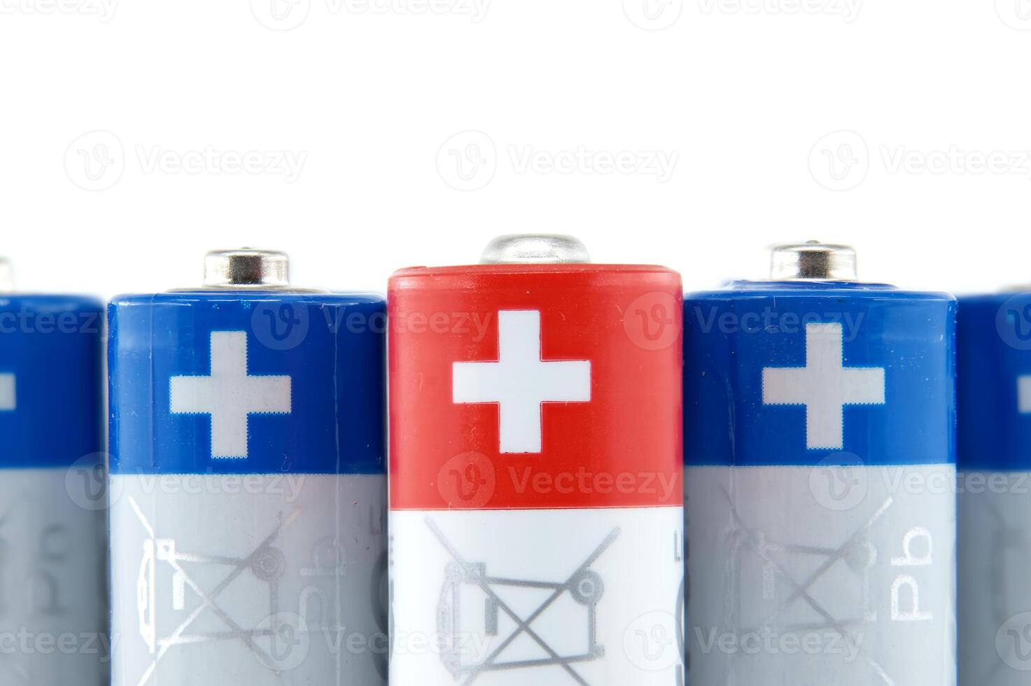 Close-up of AA batteries showing the positive terminals photo