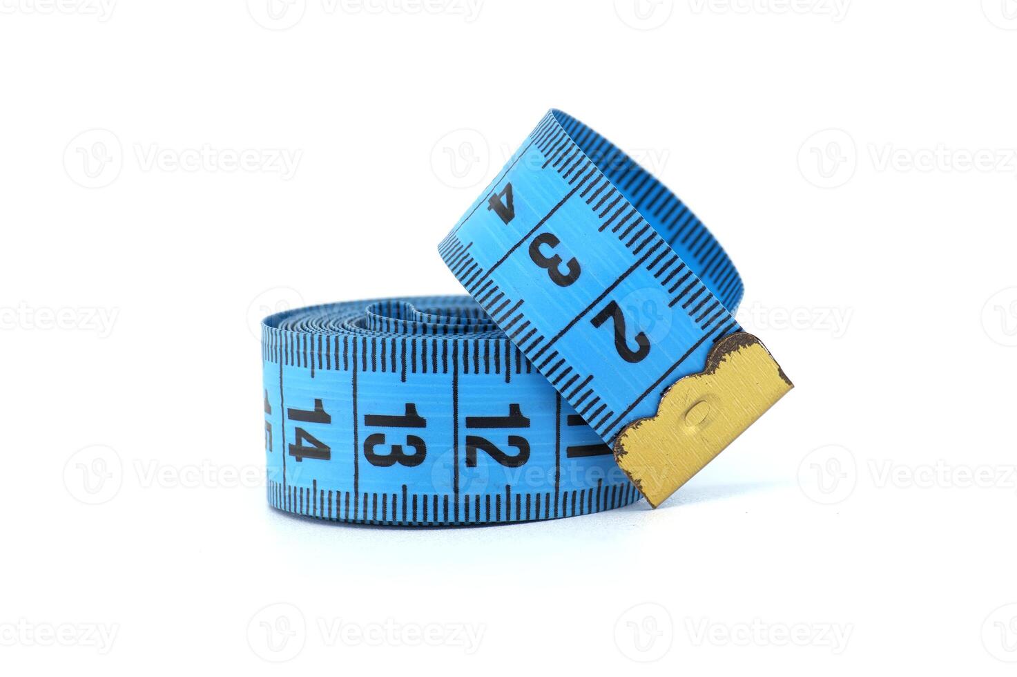 Close-up of a blue measuring tape rolled up on a white background photo