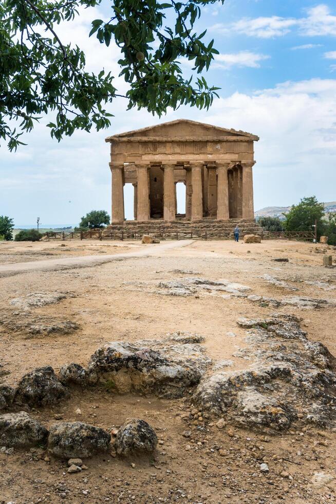 Agrigento, Italy-May 10, 2022-people near the Temple of Concordia inside the valley of the temples, an archaeological park near Agrigento during a sunny day photo